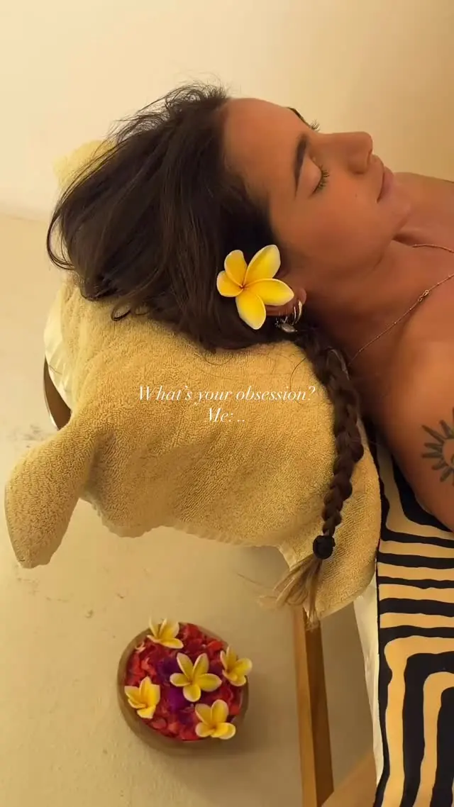 A guest relaxing during a facial
